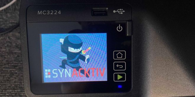 Photo of the Synacktiv Ninja on a hacked printer screen